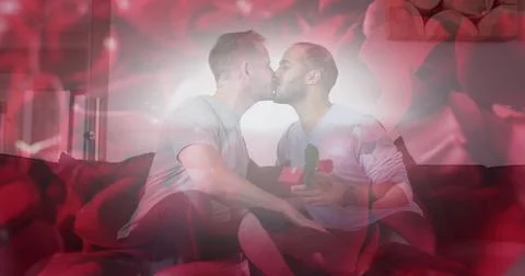 Image of red roses over diverse male couple kissing Ilustração Stock