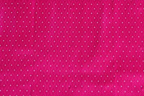 The image of the red Thai silk pattern that is woven in Thailand. Stock Photos