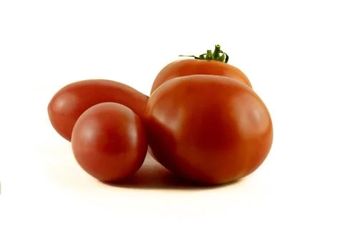 Image of ripe red tomatoes on a white background. Stock Photos