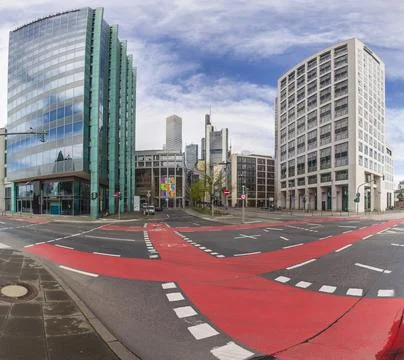 Image of a road junction with a red colored cycle path in front of the Fran.. Stock-Fotos