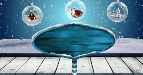 Image of road sign with copy space over snow falling and baubles on blue Ilustração Stock
