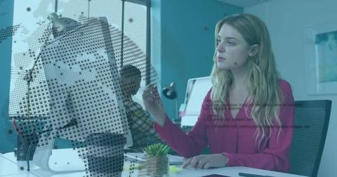 Image of rotating globe and computer language over caucasian woman analyzing 库存照片