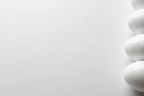 Image of row of white easter eggs and copy space on white background Stockfoto's