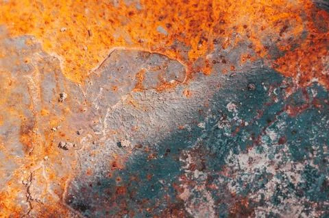 The image is of a rusty surface with a blue and orange color scheme Stock Photos