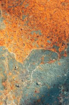 The image is of a rusty surface with a blue and orange color scheme Stock Photos