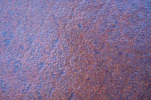 The image is of a rusty surface with a blue tint Stock-Fotos