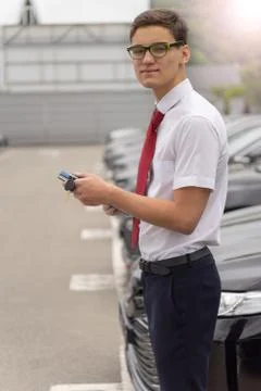 Image of a sales Manager, representative of a car dealership. Concept of sell Stock Photos