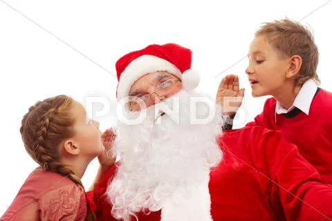 Image of santa listening to little boy and girl whispering their wishes for chri Stock Photos