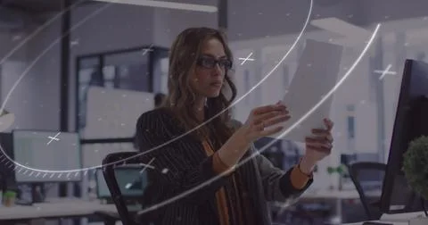 Image of scanner processing data over caucasian businesswoman reading document Stock Photos