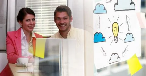 Image of schema with arrows with clouds over two caucasian business people Stock Photos