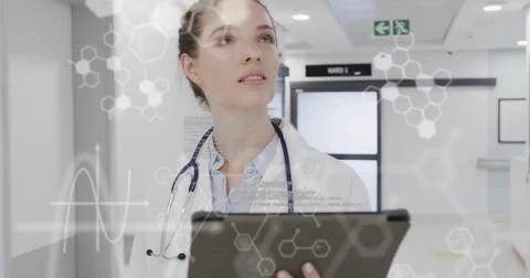 Image of science data processing over caucasian female nurse using tablet Stock Photos