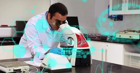 Image of scientific data over biracial male lab worker using microscope Foto stock