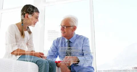 Image of scientific data over caucasian senior male doctor checking girl Stock Illustration