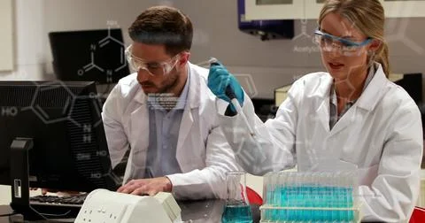 Image of scientific data over caucasian female and male lab workers with samples Stock Photos