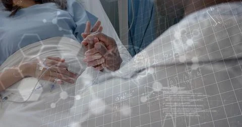 Image of scientific data over diverse male doctor and patient in hospital Stock Photos