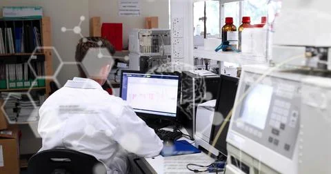 Image of scientific data processing over male scientist using computer Foto stock