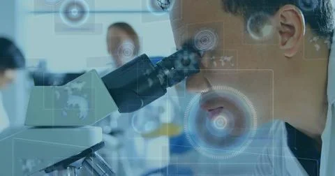 Image of scopes scanning and data processing on screens over male scientist with Stock Photos