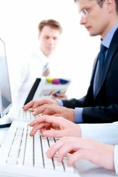 Image of secretary hands typing document on the background of working people Stock Photos