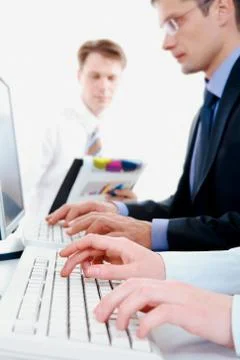 Image of secretary hands typing document on the background of working people Stock Photos
