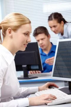 Image of secretary typing document on the background of working people Stock Photos