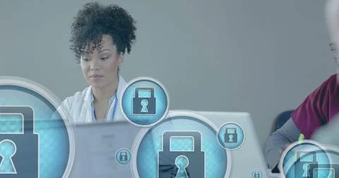 Image of security padlock data processing over diverse doctors in office 写真素材