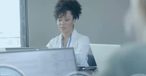 Image of security padlock data processing over diverse doctors in office Stock Photos