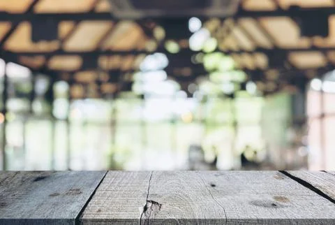 Image of Selected focus empty wooden table and Coffee shop or blurred cafe ba Stock Photos
