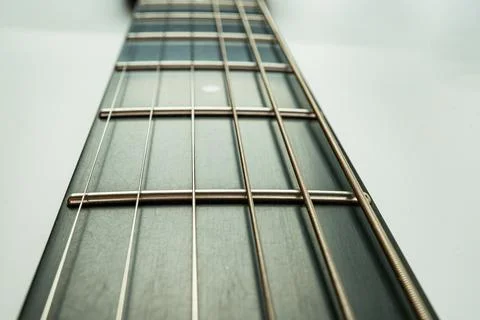 Image of sharp, centered close-up view of a guitars fretboard, showcasing b.. Foto stock