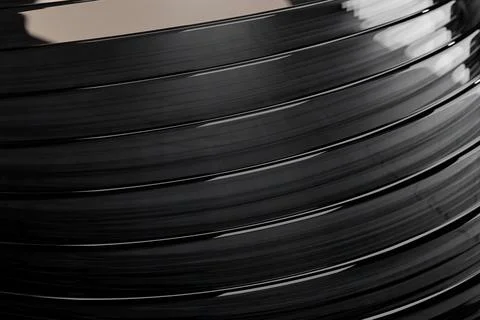 Image of shiny dark grey round objects with layers with a light. Stock Illustration