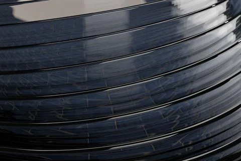 Image of shiny dark grey round objects with layers with a light reflection of a Stock Illustration