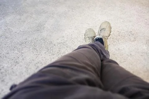 An image of shoes of a man having a rest Stock Photos