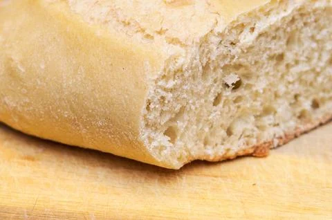 This image showcases a close-up view of a loaf of bread, highlighting its t.. Stock Photos