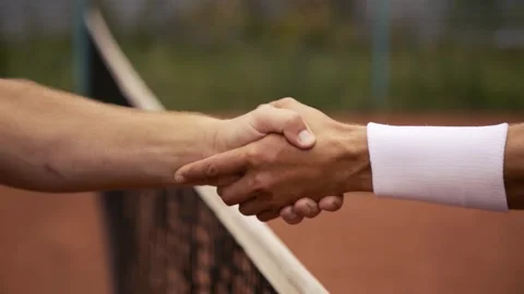 This image showcases a closeup view of a tennis net that is situated on a clay Stock Footage 285605602