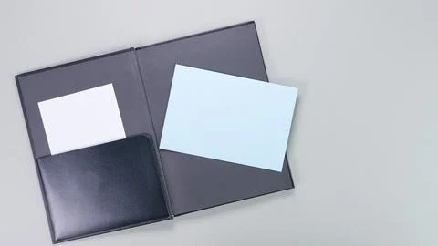 The image showcases an open black leather portfolio cover, elegantly displayi Stock Photos