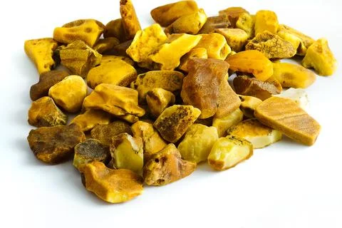 This image showcases raw Polish Baltic amber on a white surface, highlighting Stock Photos