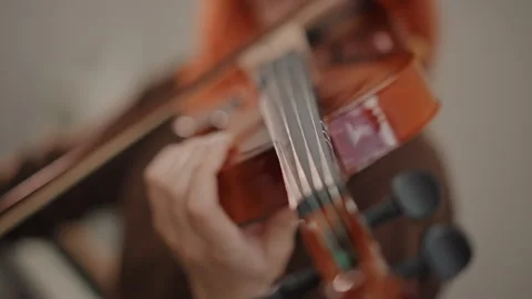 Image showcasing detailed view of violin strings and tuning parts. Magnified Stock Footage 346555526