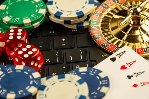Image shows casino items, including playing cards, dice 1 and 2, a roulette w Stock Photos