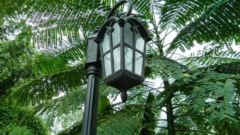 This image shows a classic lantern style garden light or street light. Photos