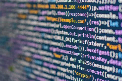 Image shows a close-up of a colorful coding text editor on a computer scree.. Stock Photos