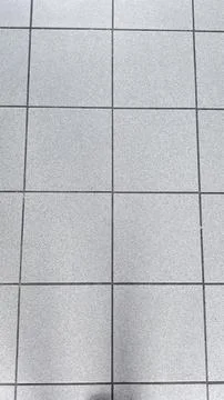 This image shows a close-up of a tiled floor, perfect for backgrounds or te.. Stock Photos