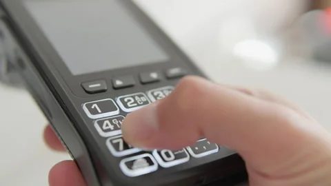 This image shows a closeup of a hand using a modern touchscreen smartphone with Video stock 317027553