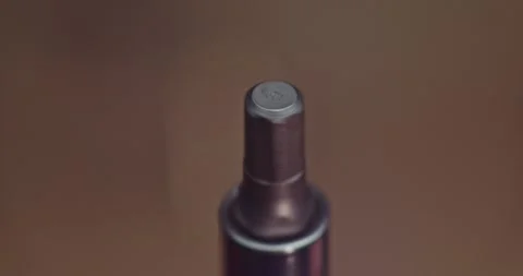 The image shows a closeup view of a hex bit tool head, highlighting its details Stock Footage 297952651