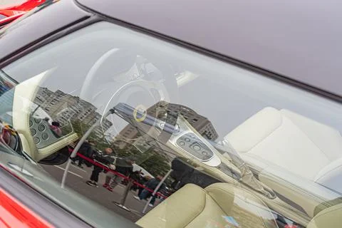Image shows a driver operating a touchscreen interface inside a car, with o.. Stock Photos