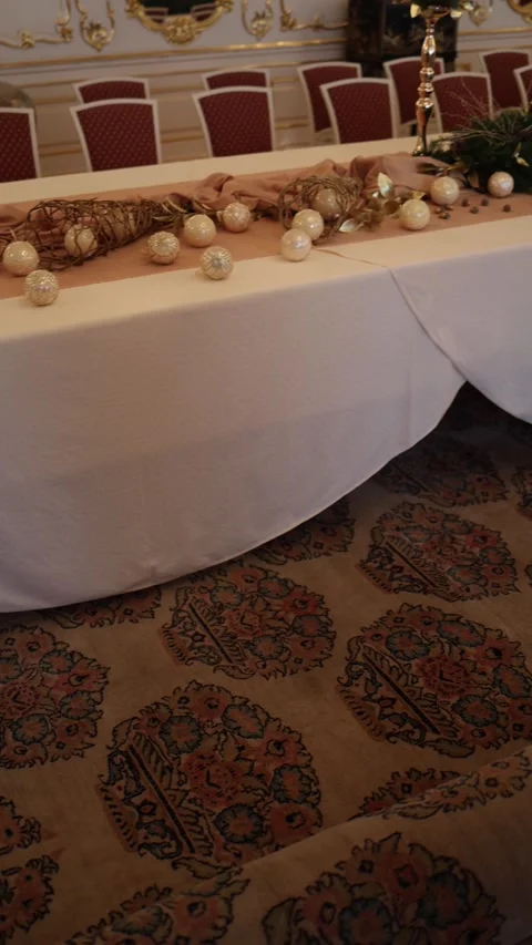 The image shows a festively decorated table with Christmas ornaments and a decor Stock Footage 294714083