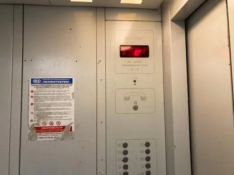 Image shows a functional interior view of an operating elevator with Russian  Foto stock