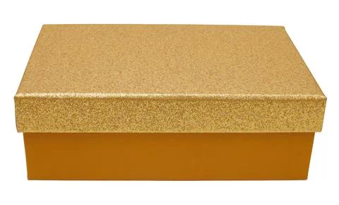 The image shows a gift box with a shiny gold top resting on a plain white bac Stock Photos