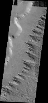 This image shows how the wind is eroding the material of Gordii Dorsum Cop... Stock Photos