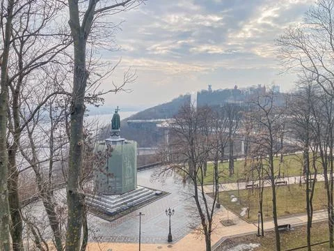 Image shows a landscape with a rectangular, greenish-blue building in the for Stock Photos