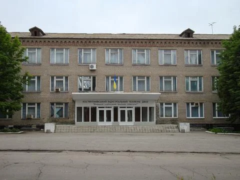 The image shows a large, classical multi-story building with symmetrical faca Stock Photos