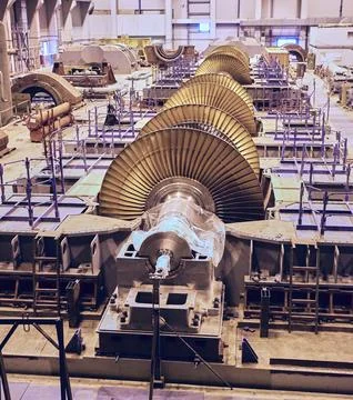 This image shows a large turbine in the process of being constructed in a mod Stock Photos